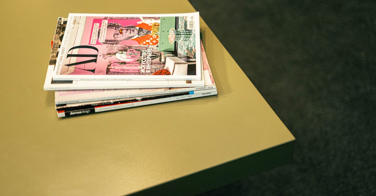 A neat stack of colorful magazines on a modern table with a minimalistic design.